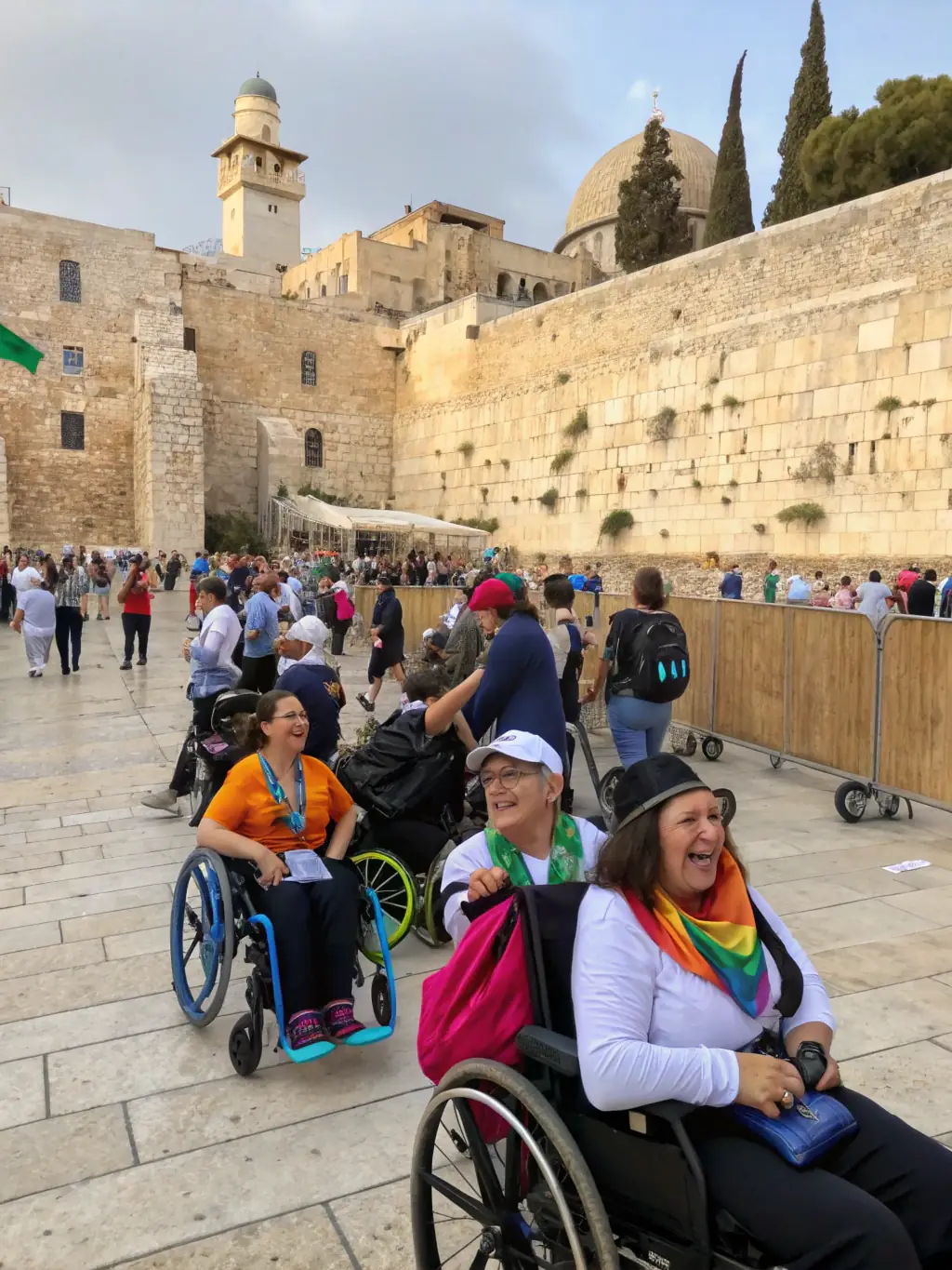 A group of travelers enjoying a guided tour at the Western Wall, with a lively and engaging guide explaining the history.